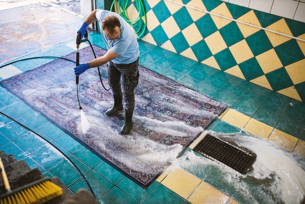 A careful cleaning process of a wool rug, highlighting the gentle washing and drying technique.